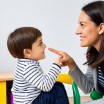 A professional female speech therapist, fully clothed in modest, professional attire, sits on a child-sized chair, gently interacting with a young child (approximately 4 years old), fully clothed in appropriate, family-friendly play clothes. They are in a bright, clean, and modern speech therapy room filled with age-appropriate educational toys and colorful learning materials. The therapist is demonstrating a language game with a deck of picture cards, and the child is attentively engaged, pointing to an image. The pose is natural, displaying perfect anatomy, correct proportions, well-formed hands, proper finger count, and natural body proportions. The image is rendered with professional photography quality, soft lighting, appropriate content, and is safe for work.